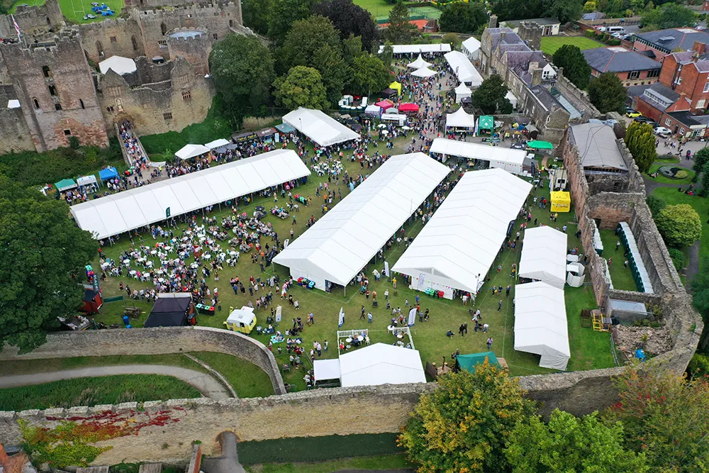 A birds eye view of Ludlow Castle's Outer Bailey with the Festival in full swing